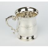 A baluster silver mug with fancy S scroll handle and presentation inscription Birmingham 1938 208