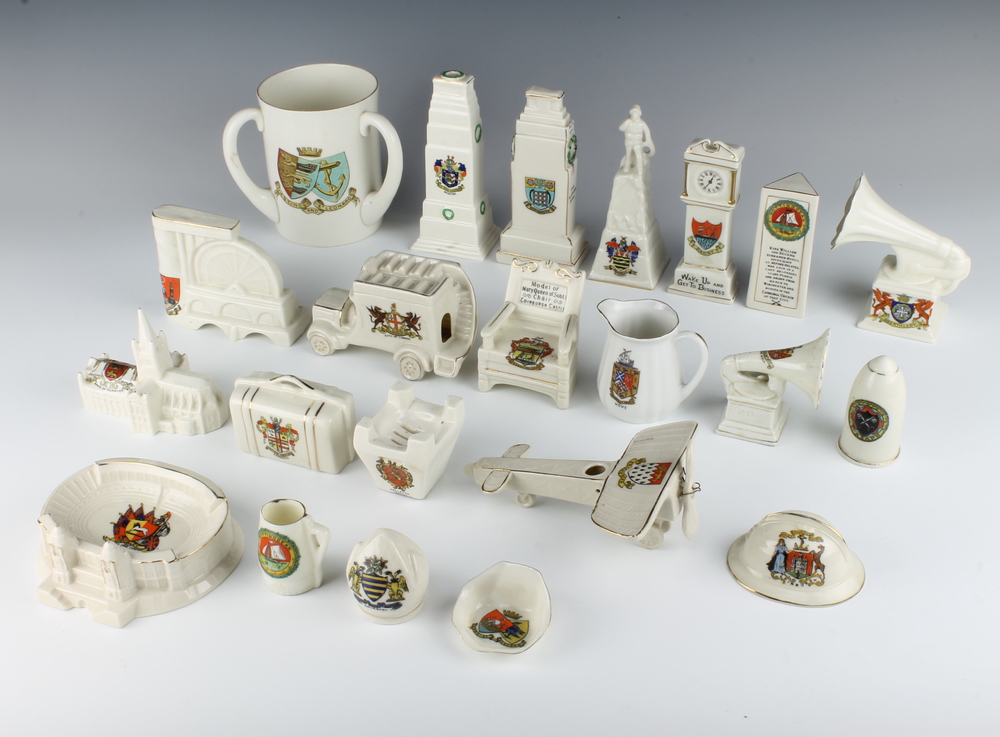 A collection of crested china including plane, gramophone and longcase clock