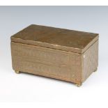 A Newlyn style rectangular copper box with hinged lid raised on bun feet 12cm x 23cm x 13cm (