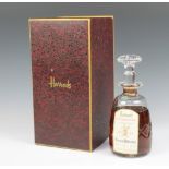 A Stuart cut glass decanter of 12 year old pure highland malt whisky, specially selected for Harrods