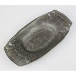 A Liberty's Art Nouveau boat shaped English pewter dish with stylised leaf decoration, the base