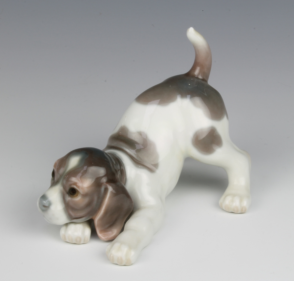 A Lladro figure of a crouching puppy 15cm