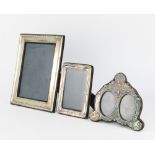 A rectangular silver photograph frame London 1987 25cm x 20cm and 2 others The 1st item is dented