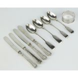 A silver napkin ring Birmingham 1929, 4 silver teaspoons and 4 butter knives, 77 grams