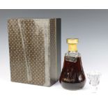 A 1970's bottle of Bisquit Fine Champagne Napoleon Cognac contained in a Baccarat decanter, in