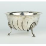 A Victorian silver bowl of plain form with shell leaves and hoof feet, Dublin 1883, 162 grams,