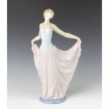 A Lladro figure of a lady holding out her dress 31cm One thumb and one finger F