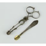 A pair of Georgian silver scissors, sugar nips and a spoon