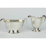 A silver panelled milk jug and sugar basin Birmingham 1933, 380 grams