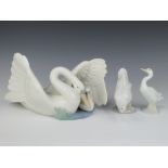 A Nao group of a swan and a cygnet 26cm, 2 Nao figures of geese