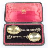 A pair of 19th Century Dutch silver apostle spoons with angel terminals, open stems and gilt