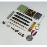 A silver propelling pencil and minor items