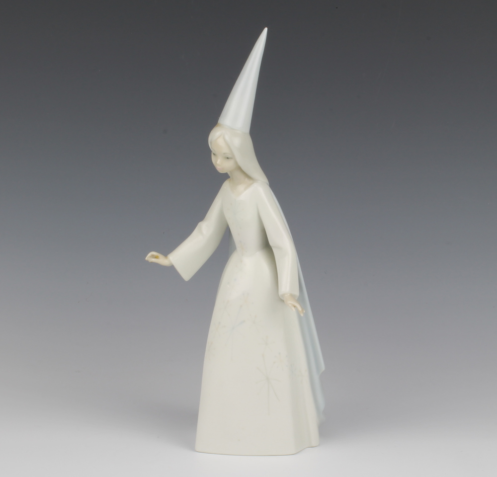 A Lladro figure of a fairy 28cm Her wand is missing and there are minor chips to a finger