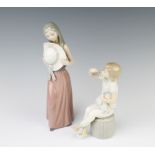 A Lladro figure of a young lady holding a hat 25cm, a do. of a girl with dog sitting on a pouffe