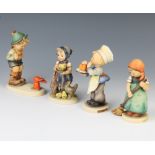 Four Hummel figures - boy with rabbit 12cm, Feeding Time 10cm, Little Sweeper 10cm, Baker 12cm There