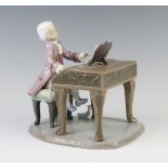 A Lladro figure of an 18th Century child sitting at a square piano, the base signed J Ruiz no.270