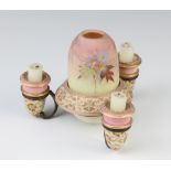 A Victorian ceramic 4 light candle holder with a Thomas Webb Queens Burmese Ware painted opaque