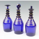 Three 19th Century Bristol blue and gilt decorated spirit bottles Rum, Brandy and Hollands 24cm2