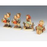 Four Hummel figures - Surprise 10cm, a boy with concertina 6cm, a girl on a fence 10cm and a boy and