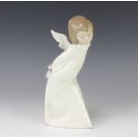 A Lladro figure of an angel 24.5cm