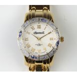 A lady's gilt Ingersoll quartz wristwatch with gem set bezel in original box