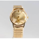 A gentleman's 9ct yellow gold Rotary wristwatch with seconds at 6 o'clock on a gilt bracelet