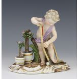 A 19th Century Meissen figure of a child digging before pots of flowers on a Rococo base printed and