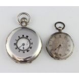 A silver half hunter pocket watch with seconds at 6 o'clock and an Edwardian silver key wind fob