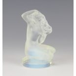 Lalique, an opalescent glass paperweight in the form of a kneeling naked lady etched R Lalique