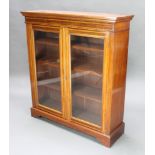 A Victorian rectangular inlaid mahogany display/bookcase with moulded and cross banded cornice,