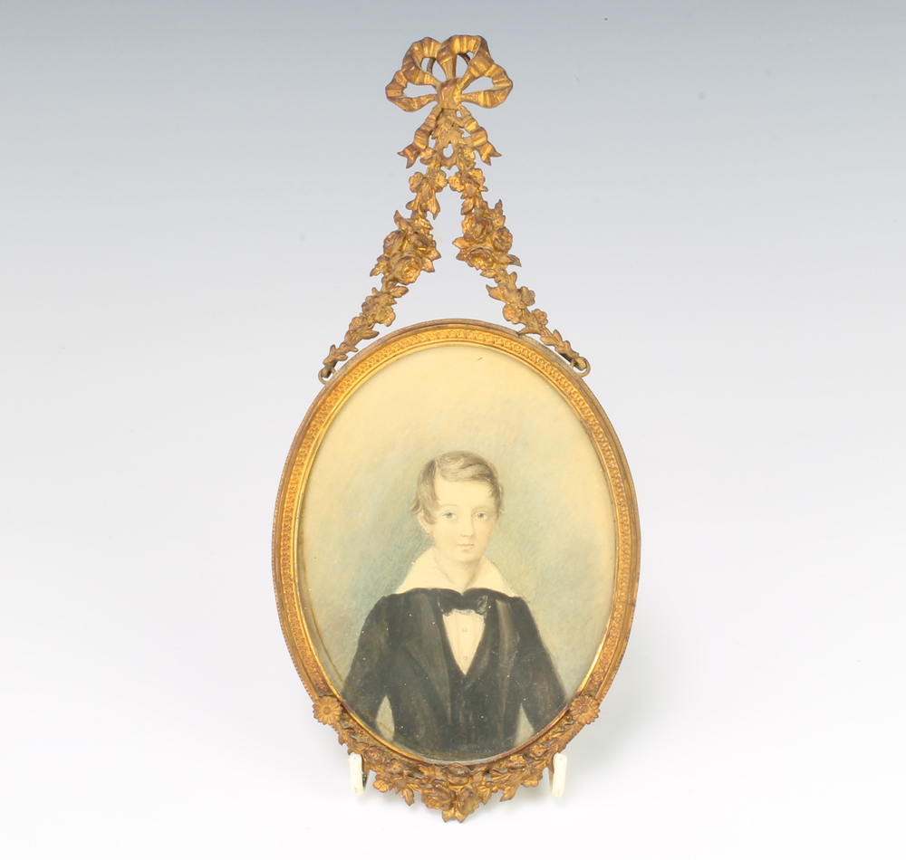 E C De Molegues, watercolour, unsigned, oval portrait of a young boy in a fancy gilt metal frame