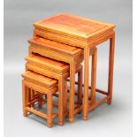 A quartetto of 4 Chinese padauk inter fitting coffee tables 76cm h x 51cm w x 35cm d, 55cm x 43cm