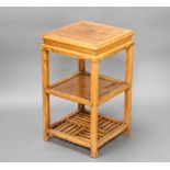 A Chinese square light padauk 3 tier jardiniere stand raised on square supports 70cm h x 41cm w x