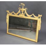 A Regency style rectangular plate wall mirror contained in a decorative gilt frame surmounted by