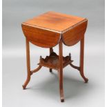 An Edwardian square drop flap mahogany occasional table fitted 4 flaps which when up form a