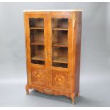 A French kingwood bookcase/display cabinet with pink veined marble top, fitted adjustable shelves