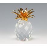 A Swarovski Crystal pineapple with gilt leaves designed by Max Schreck 010044/7507105001 boxed