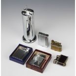 A Dunhill cigarette lighter patent no. 143752, a Parker The Roller Beacon lighter and 2 other