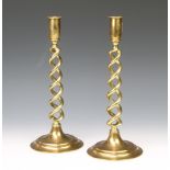 A pair of Victorian brass spiral turned candlesticks, raised on circular bases 31cm h x 13cm diam.