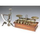 Waterlow and Sons of London, a pair of 19th Century brass and mahogany scales with 8 weights - three