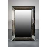 A CONTEMPORARY WALL MIRROR, within a ste