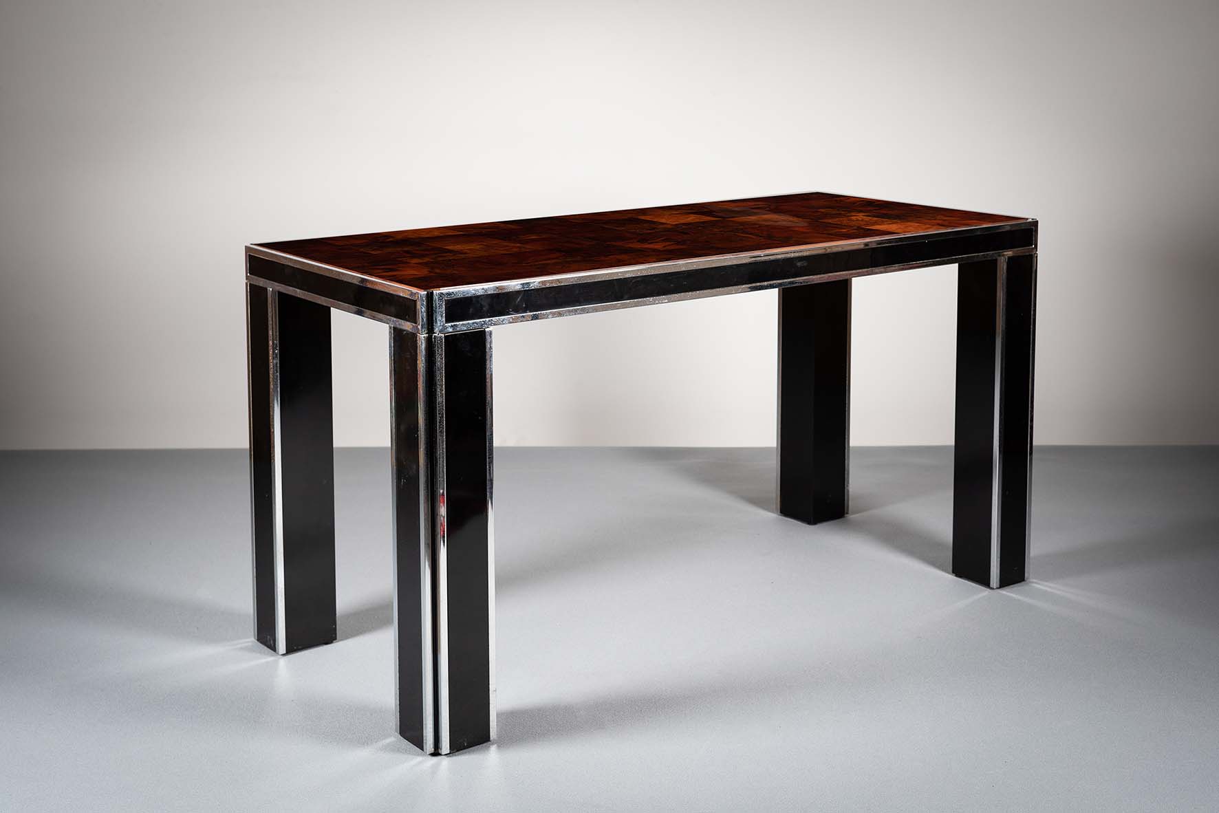 A LACQUERED WALNUT AND METAL BANDED DINI