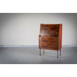 A ROSEWOOD BUREAU, Danish, 1960s, the sl