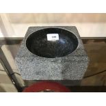 A polished granite PK Bowl by Poul Kjaer