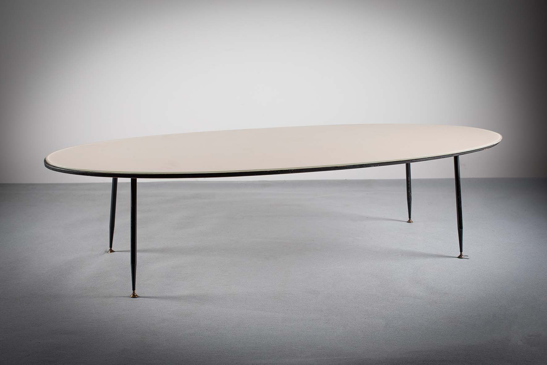 AN OVAL COFFEE TABLE, ITALIAN 1960s, wit