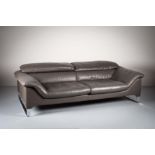A LEATHER SOFA, by Roche Bobois, with ad