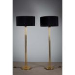 A PAIR OF BRASS STANDARD LAMPS, on colum