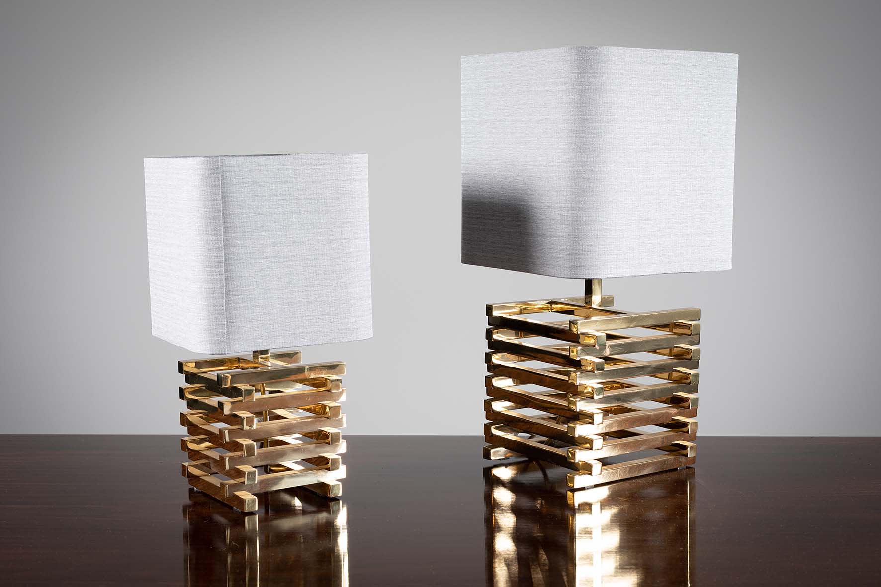 TWO GILT METAL TABLE LAMPS, 1970s, on sq