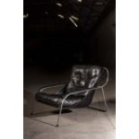 A BLACK LEATHER EASY CHAIR ITALIAN 1960's, by Zanotta, Milan, on tubular chrome supports