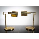 A PAIR OF BRASS ADJUSTABLE DESK LAMPS, FRENCH 1970s, on circular bases, 40cm (h)